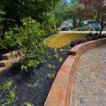 Retaining wall construction by Apex Outdoors in North Georgia, enhancing outdoor living spaces and curb appeal