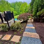Apex Outdoors stone wall and path project for residential landscaping