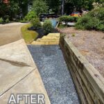 Apex Outdoors completed landscape project with new gravel pathway, wood steps, and retaining wall by driveway