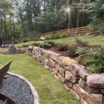 Apex Outdoors boulder retaining wall for durable backyard landscaping