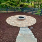 Outdoor living space with Apex Outdoors fire pit and hardscape patio