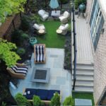 Backyard turf and landscaping project with patio seating by Apex Outdoors